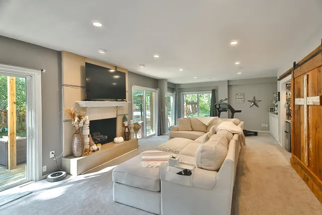 a living room with furniture fireplace and a flat screen tv