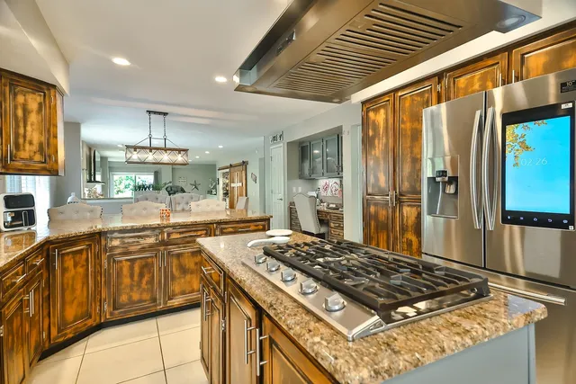 a living room with furniture a couch and potted plant