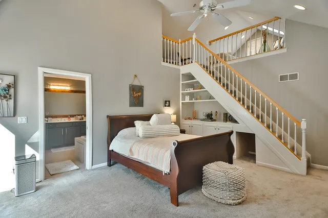 a bedroom with a bed and a fireplace