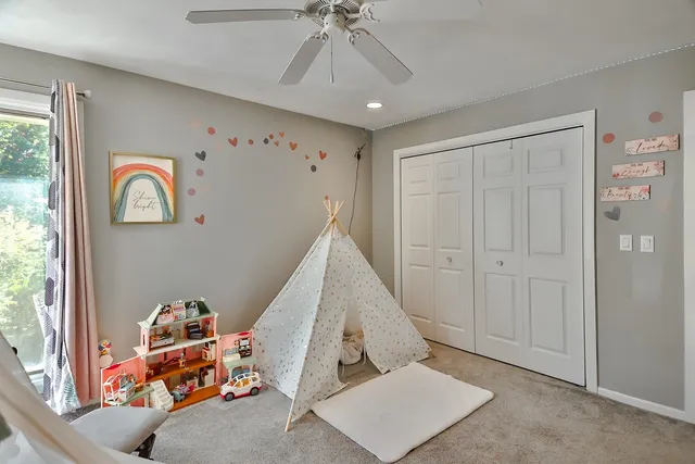 a room with toys and a flower pot