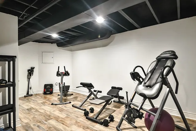 a bathroom with a granite countertop sink a toilet and a mirror