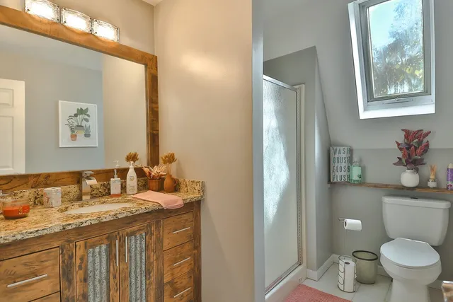 a bathroom with a double vanity sink and mirror
