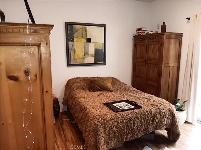 a bedroom with a bed and dresser