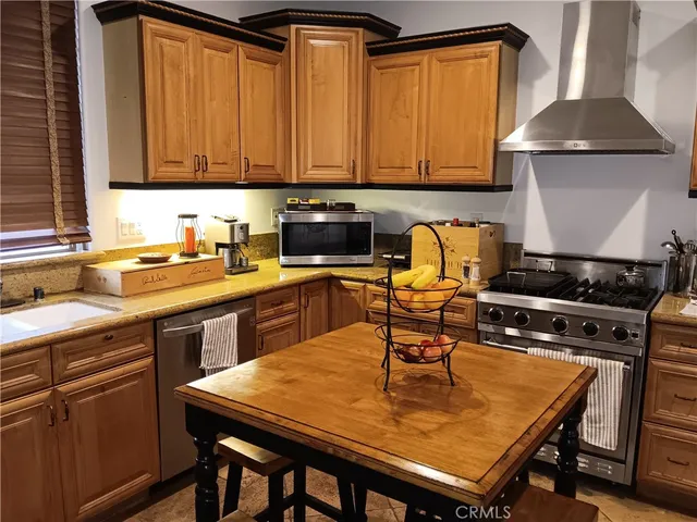 a kitchen with a table chairs and a stove