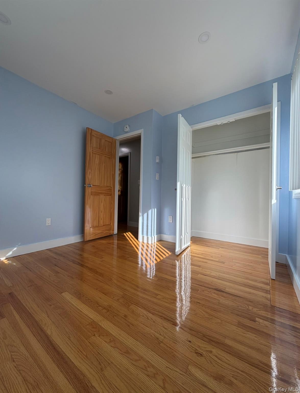 60 Medallion Road Kiamesha Lake, NY 12751 - Photo 36 of 44 a view of empty room with wooden floor and fan