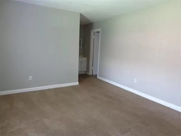 a kitchen with stainless steel appliances a refrigerator sink and cabinets