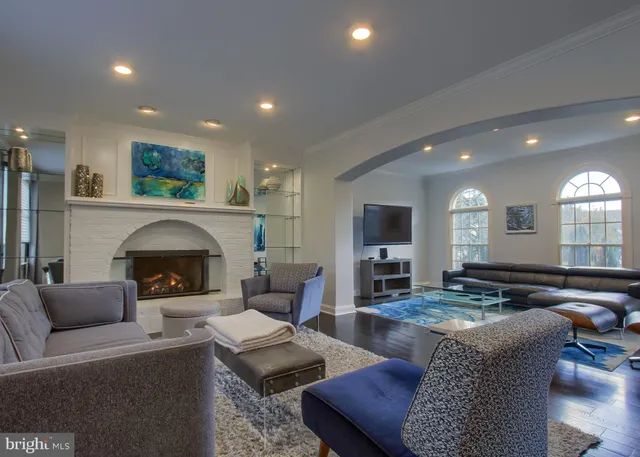 a view of an entryway with wooden floor and door