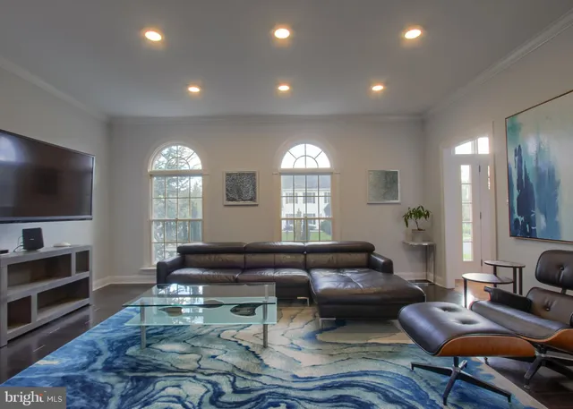 a view of a dining room with furniture wooden floor and chandelier