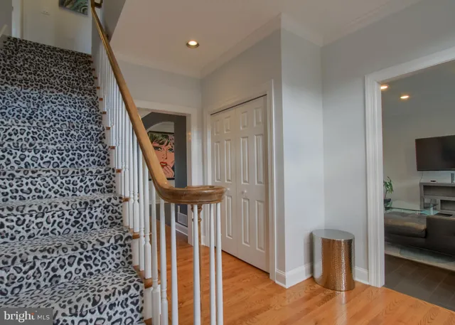 a kitchen with stainless steel appliances granite countertop a refrigerator a oven and a sink with cabinets