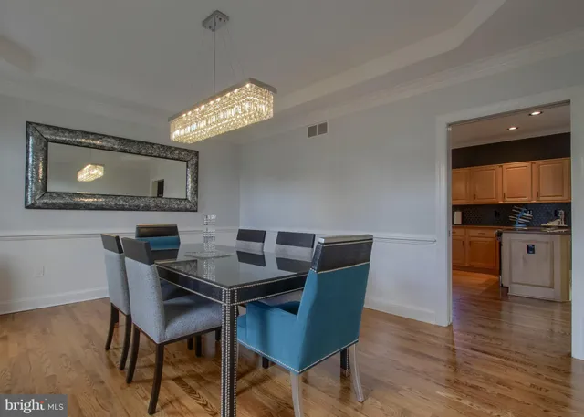 a kitchen with stainless steel appliances granite countertop a refrigerator sink and cabinets