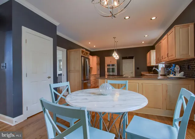 a large bed sitting in a bedroom next to a window
