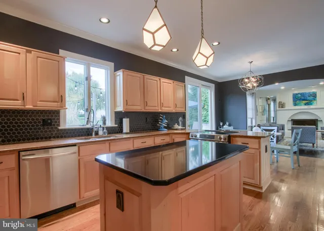 a spacious bedroom with a bed and a wooden floor