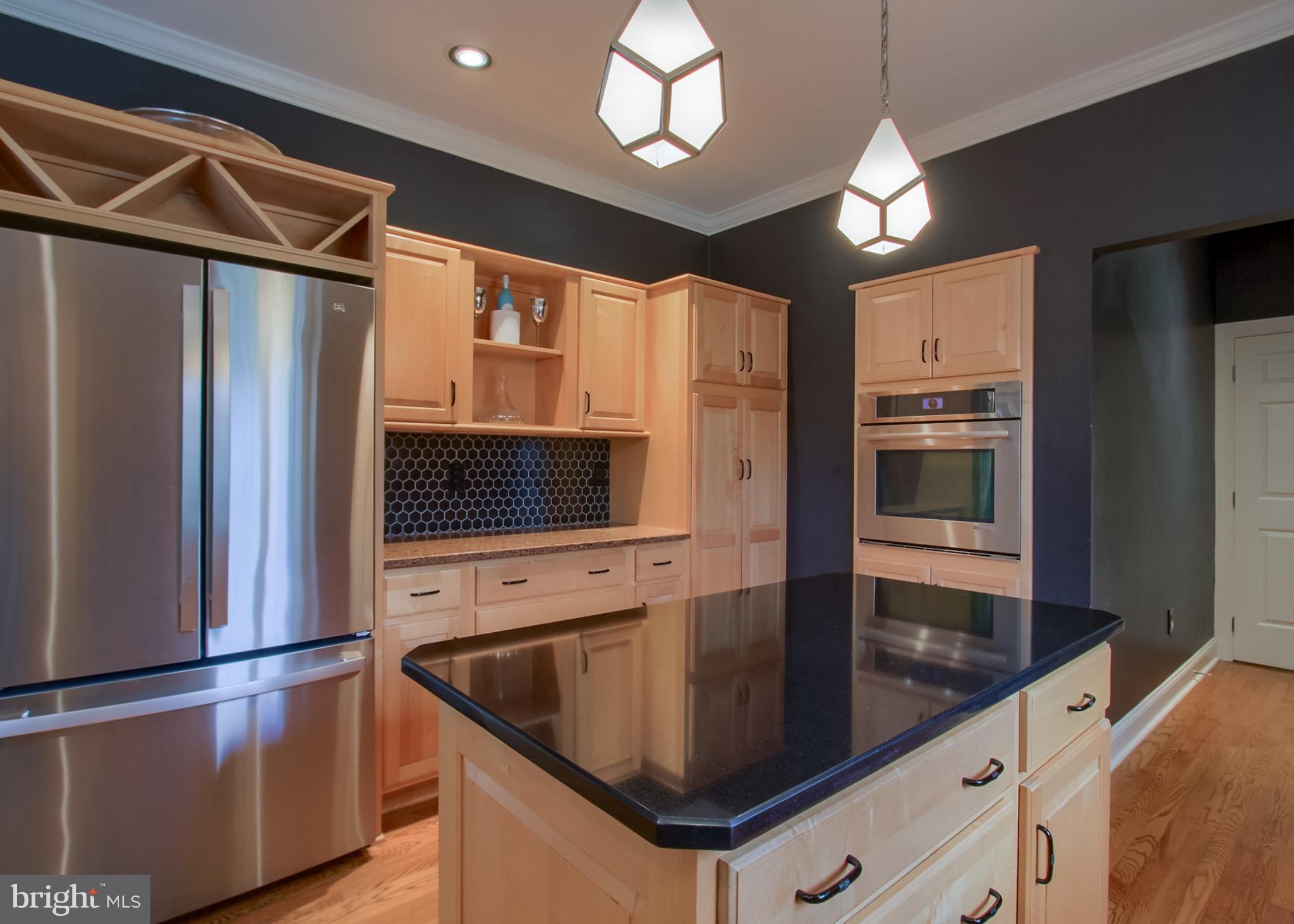 2302 Scarsborough Drive Harrisburg, PA 17112 - Photo 30 of 69 a kitchen with stainless steel appliances granite countertop a refrigerator a oven and a sink with cabinets