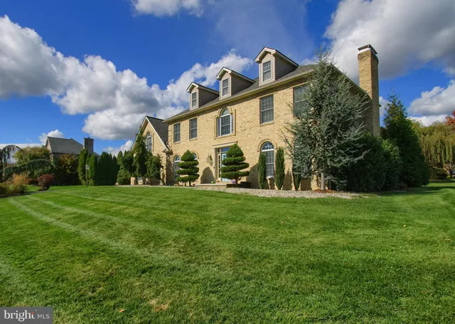 a front view of a house with patio yard and outdoor seating