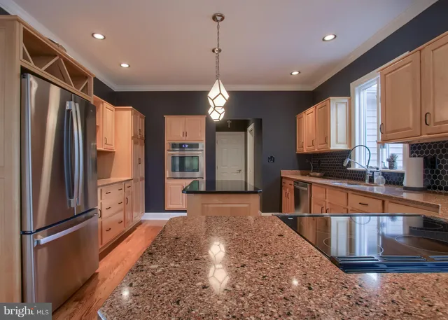 a bathroom with a tub a window and a shower