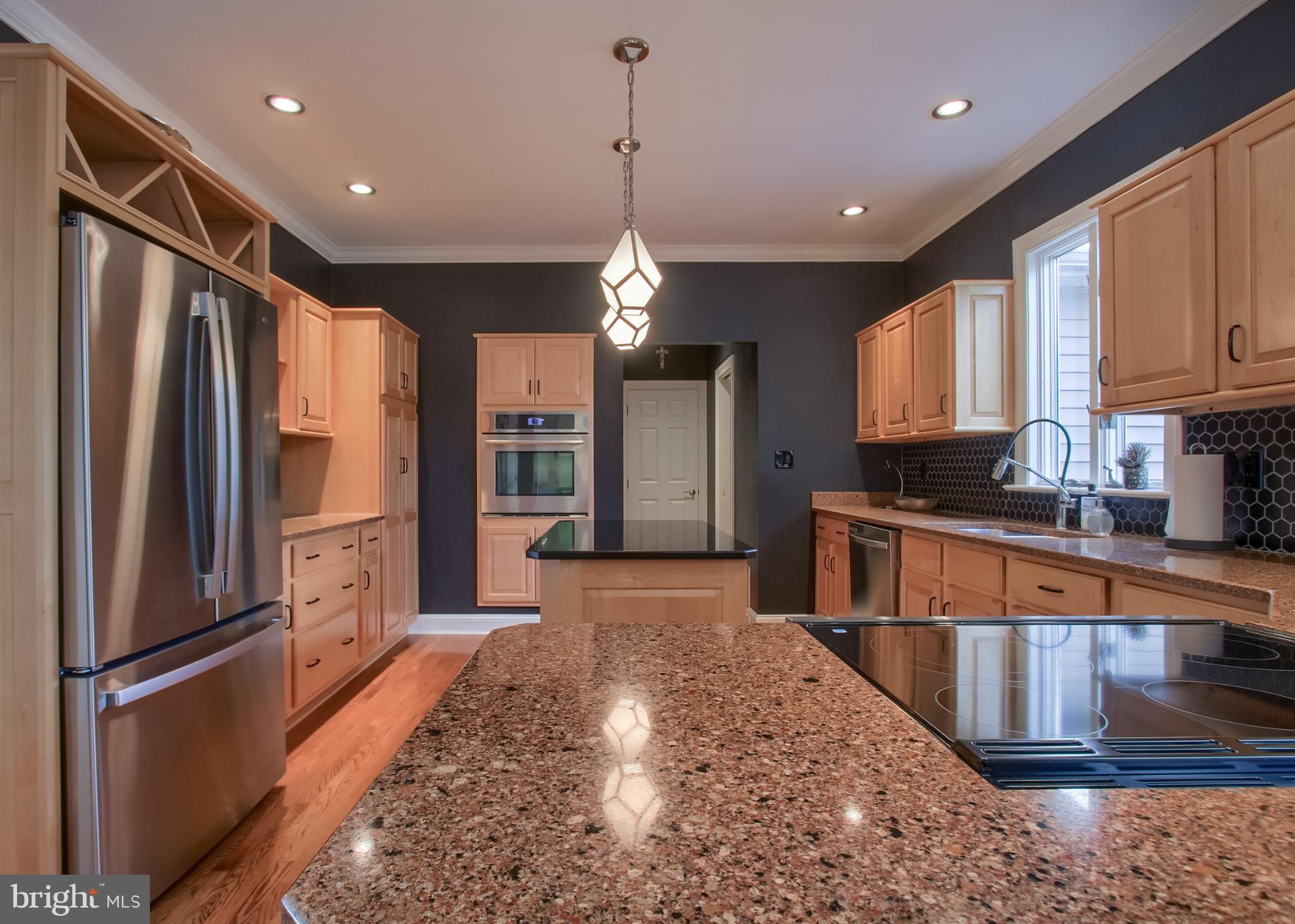 2302 Scarsborough Drive Harrisburg, PA 17112 - Photo 34 of 69 a kitchen with stainless steel appliances granite countertop a refrigerator sink and cabinets