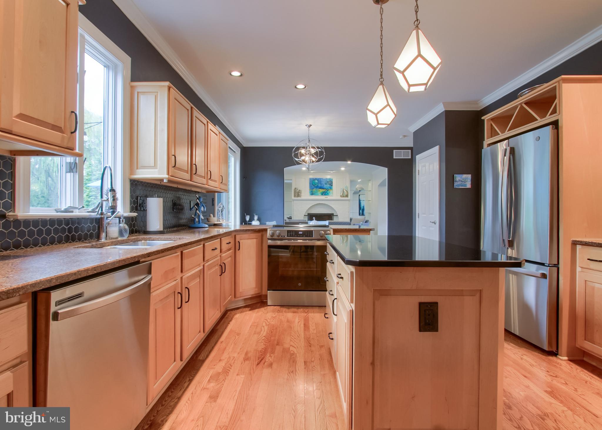 2302 Scarsborough Drive Harrisburg, PA 17112 - Photo 35 of 69 a kitchen with stainless steel appliances granite countertop a stove a sink and a refrigerator