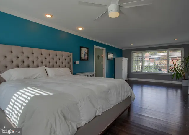 a bed room with a bed and a window