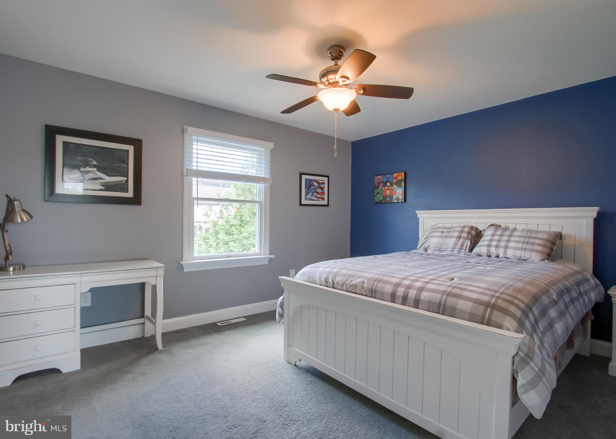 2302 Scarsborough Drive Harrisburg, PA 17112 - Photo 49 of 69 a bedroom with a bed and a chandelier