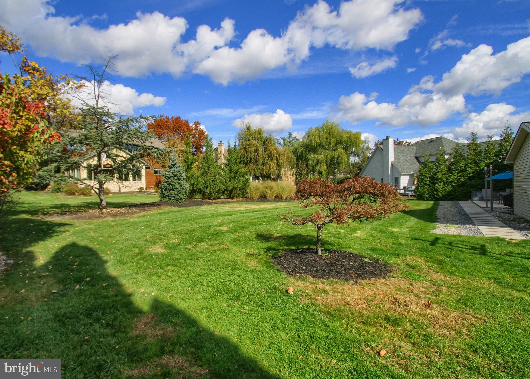2302 Scarsborough Drive Harrisburg, PA 17112 - Photo 61 of 69 Lush greenery under a vibrant sky.