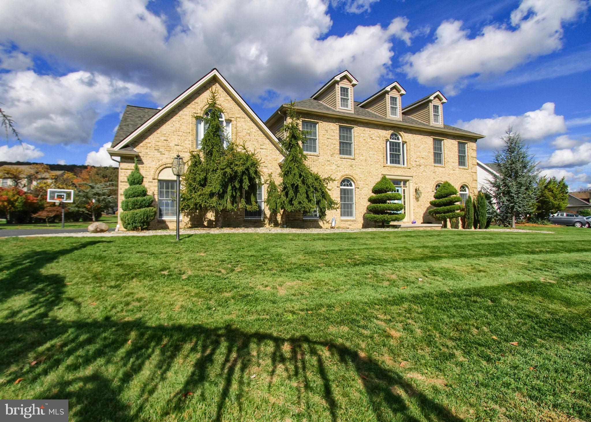 2302 Scarsborough Drive Harrisburg, PA 17112 - Photo 64 of 69 Elegant stone home with lush greenery.