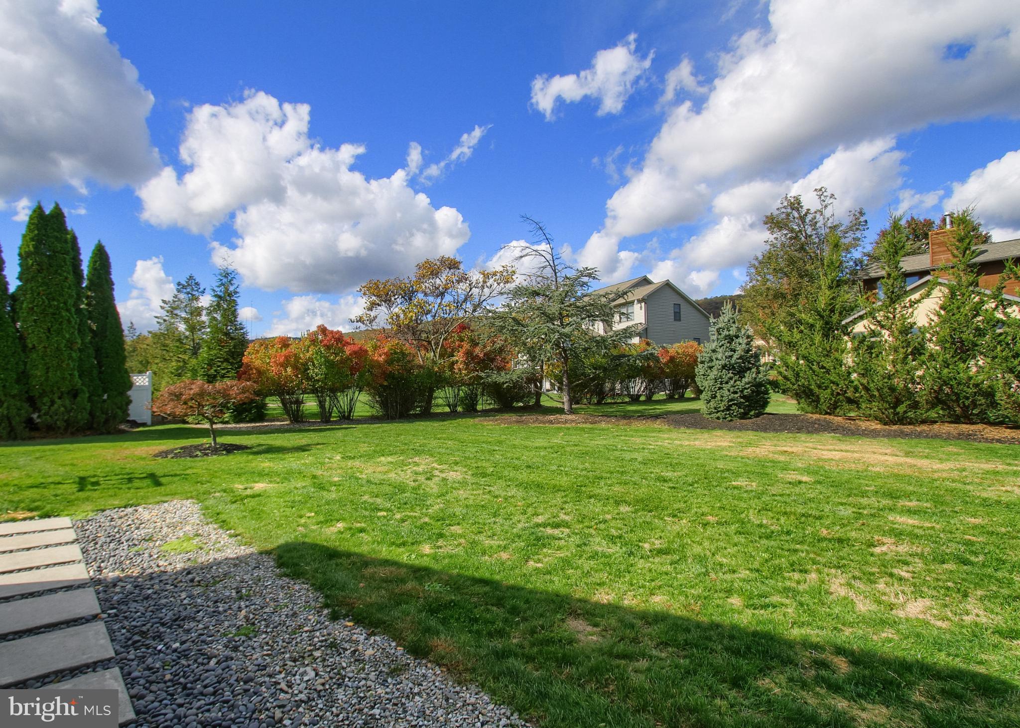 2302 Scarsborough Drive Harrisburg, PA 17112 - Photo 10 of 69 Spacious backyard under a vibrant sky.