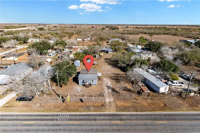 an aerial view of residential houses with outdoor space