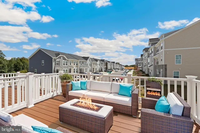 a view of a roof deck with couches
