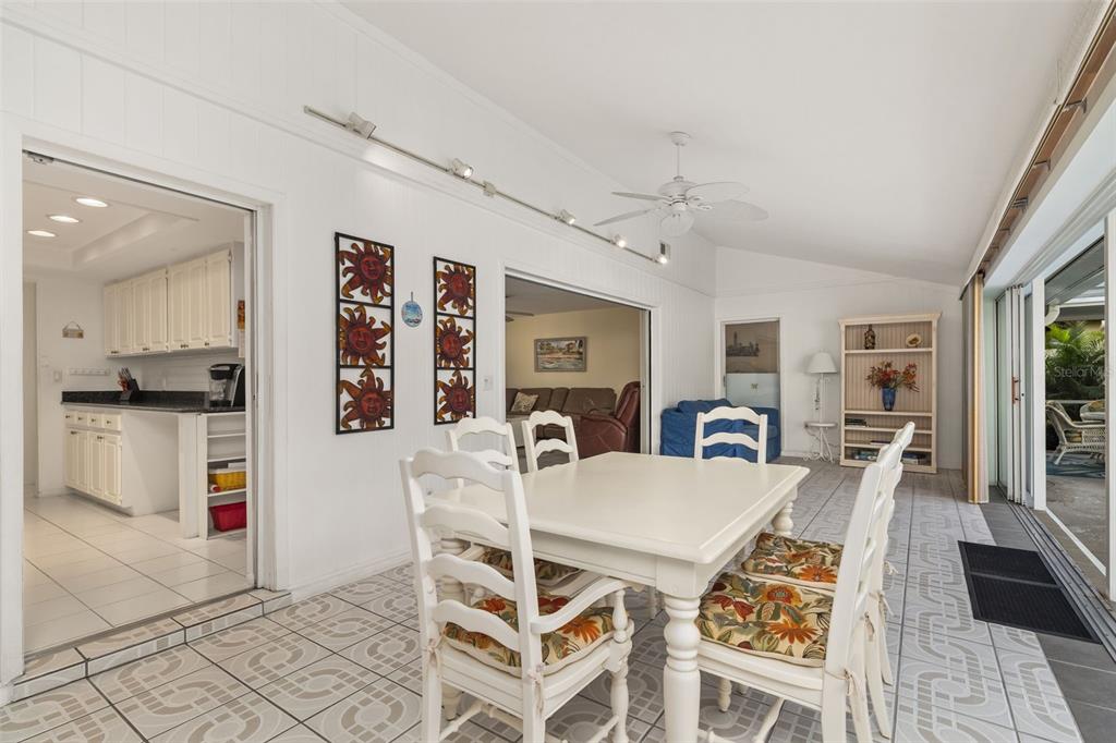440 Darling Drive Venice, FL 34285 - Photo 11 of 74 a view of a dining room with furniture and wooden floor