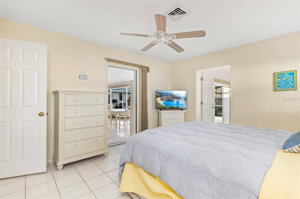 440 Darling Drive Venice, FL 34285 - Photo 21 of 74 a spacious bedroom with a bed and a cabinets