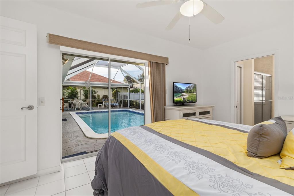 440 Darling Drive Venice, FL 34285 - Photo 25 of 74 a bedroom with a bed and a flat screen tv