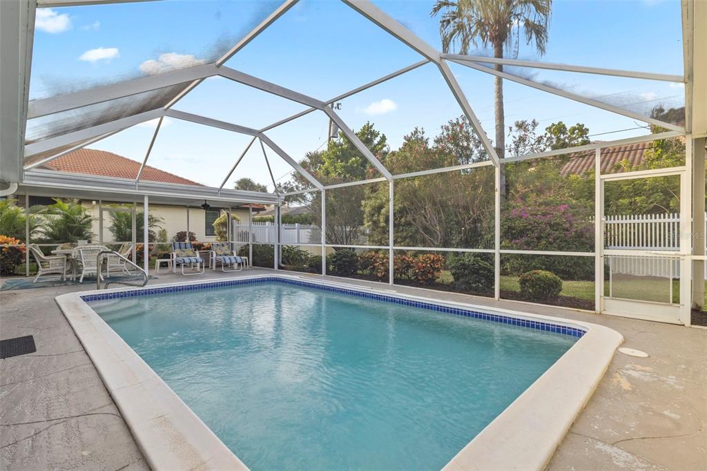 440 Darling Drive Venice, FL 34285 - Photo 28 of 74 a view of a swimming pool with a patio