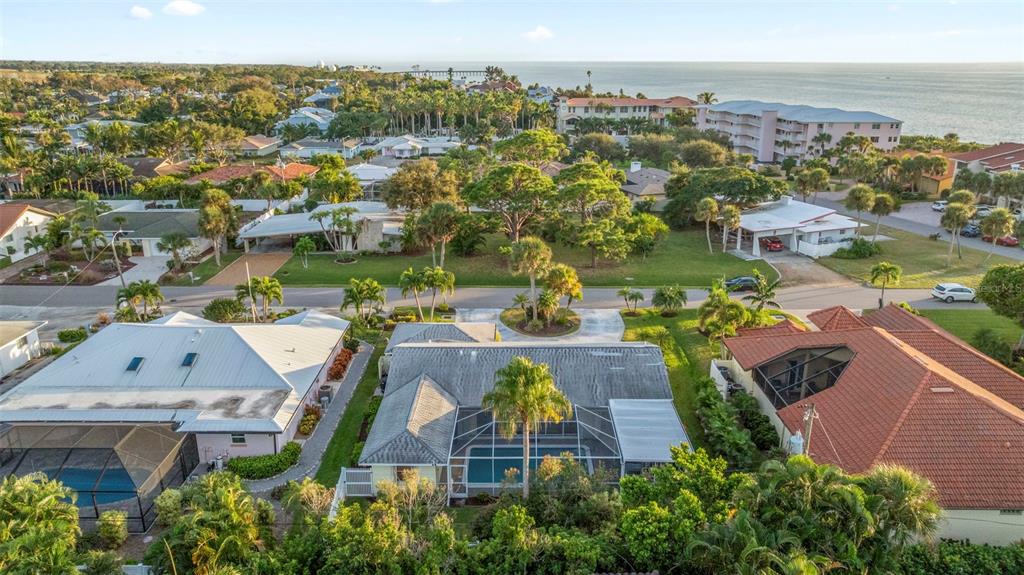 440 Darling Drive Venice, FL 34285 - Photo 43 of 74 an aerial view of house with yard swimming pool and ocean view