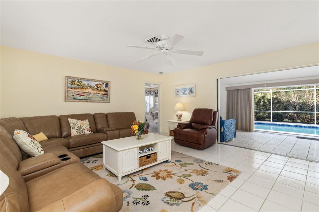 440 Darling Drive Venice, FL 34285 - Photo 5 of 74 a living room with furniture and a large window