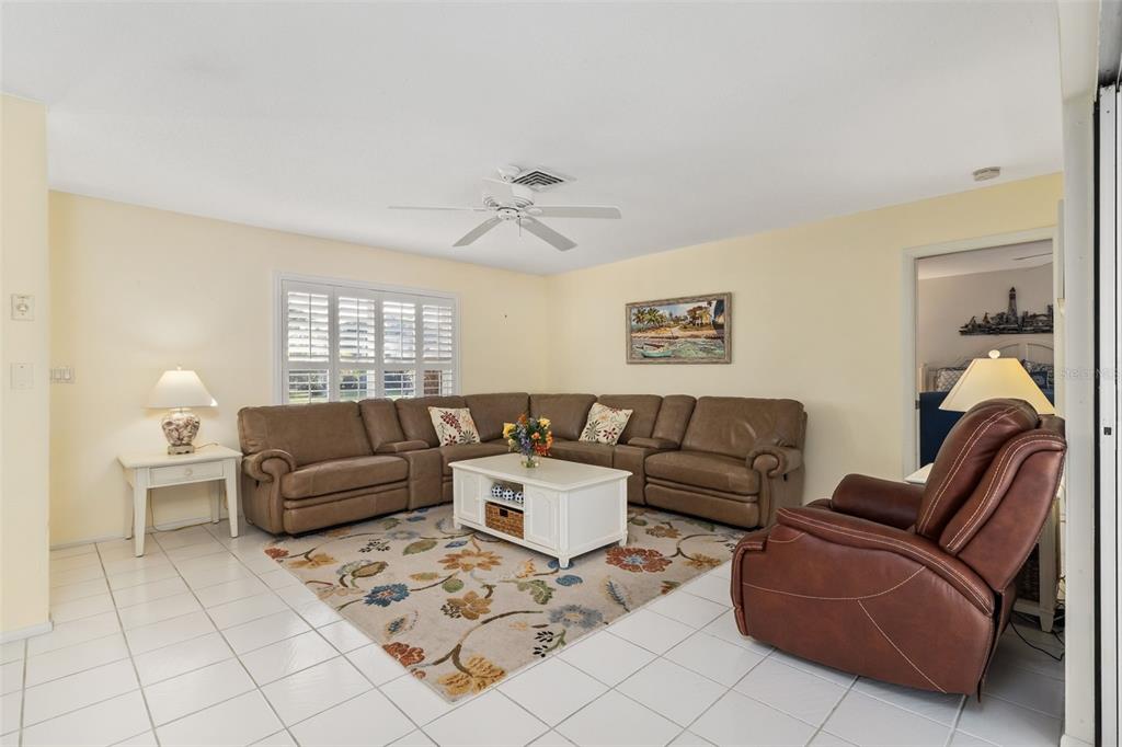 440 Darling Drive Venice, FL 34285 - Photo 6 of 74 a living room with furniture and a window