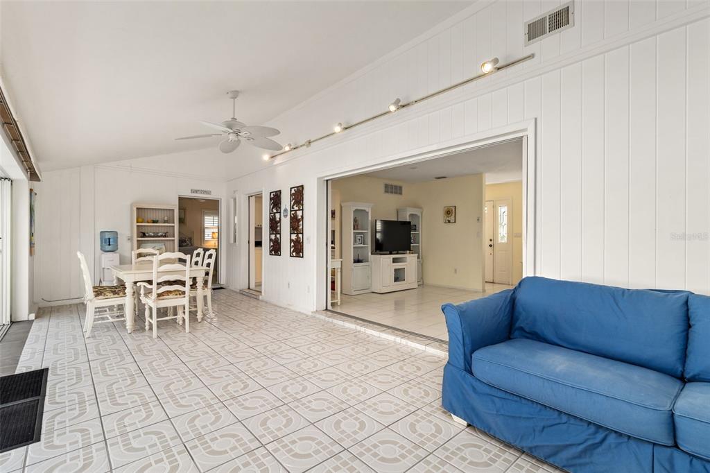 440 Darling Drive Venice, FL 34285 - Photo 10 of 74 a living room with furniture and a dining table