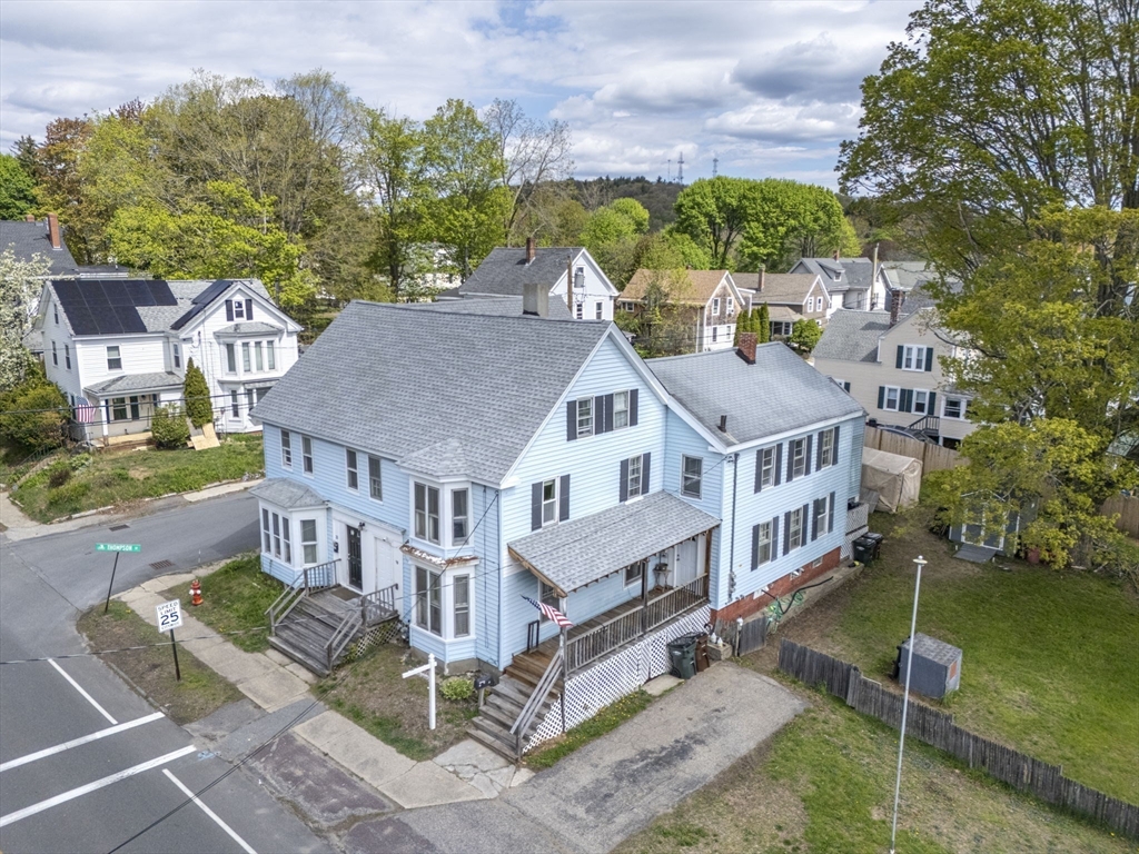 17-19 Whitehall Road Amesbury, MA 01913 - Photo 2 of 37 an aerial view of a house with a yard table and chairs