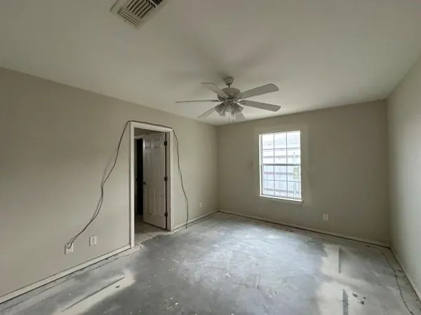 a view of an empty room with a window