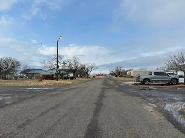 a view of a city street with cars