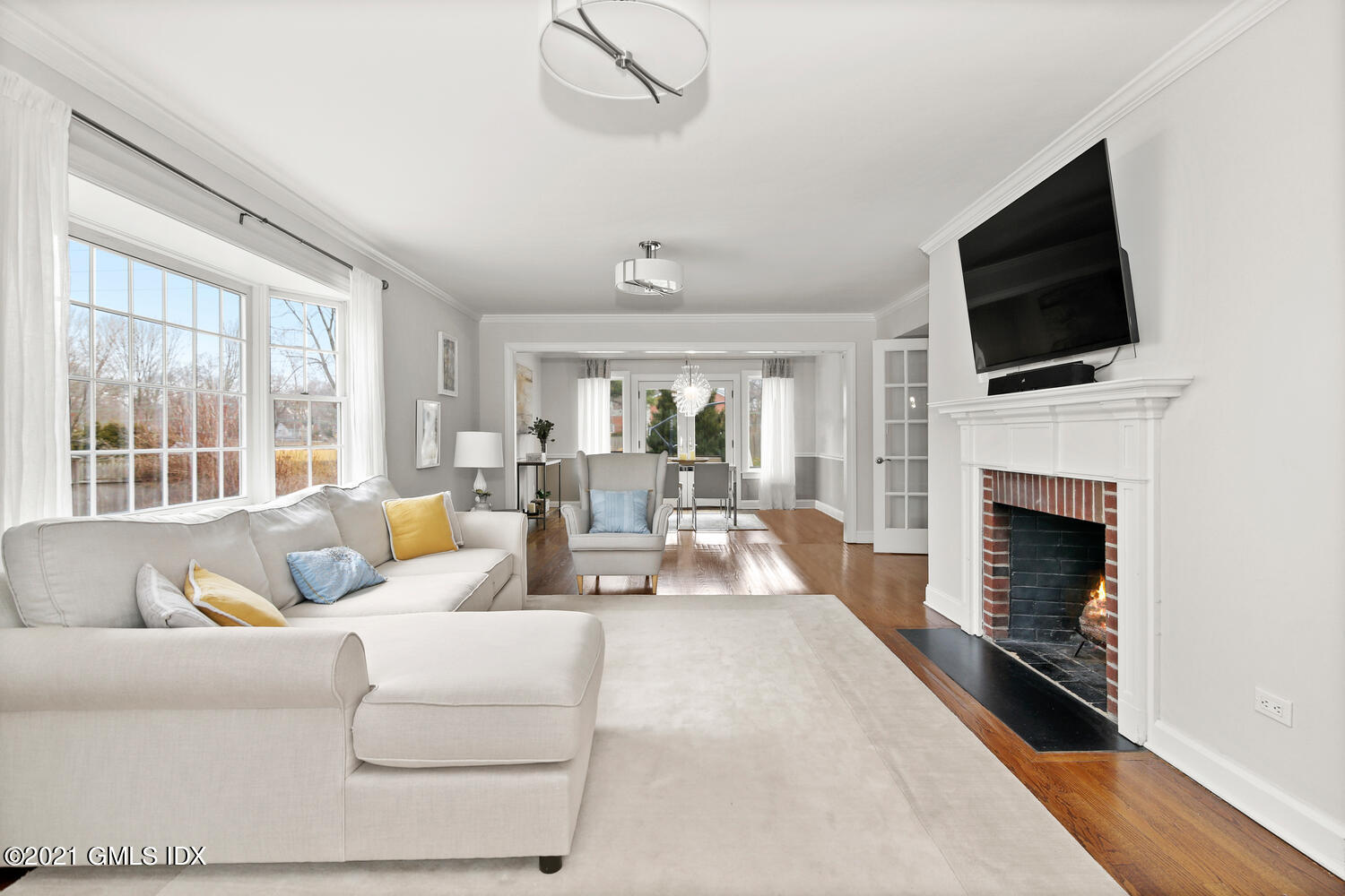 65 Summit Road Riverside, CT 06878 - Photo 3 of 20 a living room with fireplace furniture and a flat screen tv