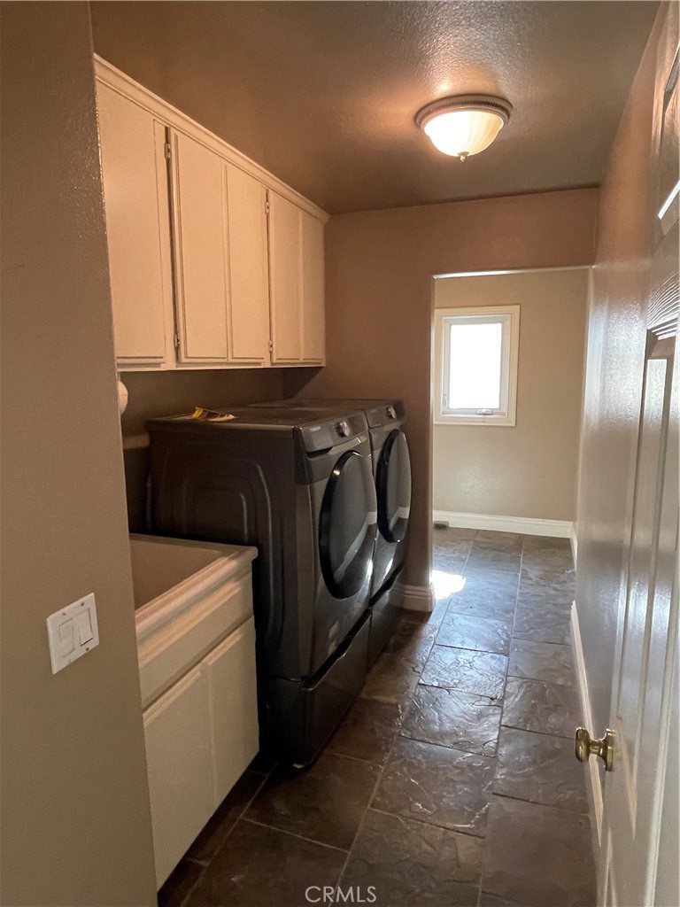 1 Vía Perico Rancho Santa Margarita, CA 92688 - Photo 17 of 22 a utility room with dryer and washer