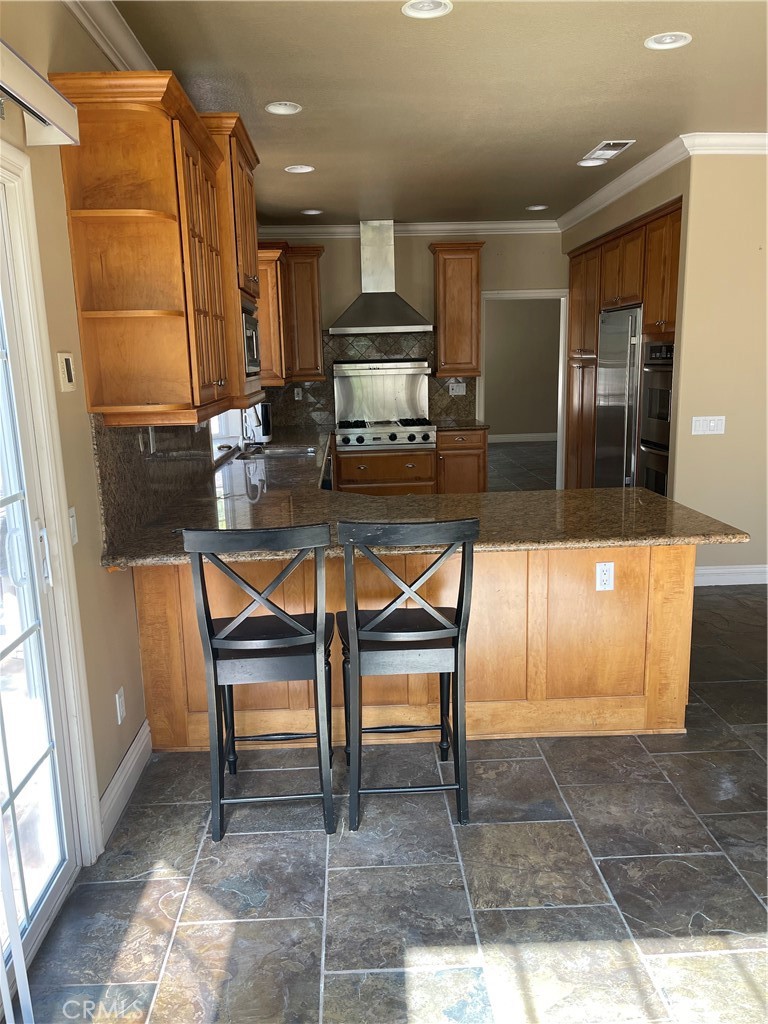 1 Vía Perico Rancho Santa Margarita, CA 92688 - Photo 20 of 22 a kitchen with a table chairs and entryway