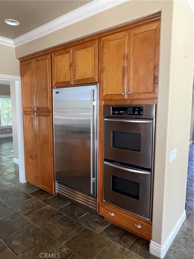 1 Vía Perico Rancho Santa Margarita, CA 92688 - Photo 21 of 22 a kitchen with a stove and a refrigerator