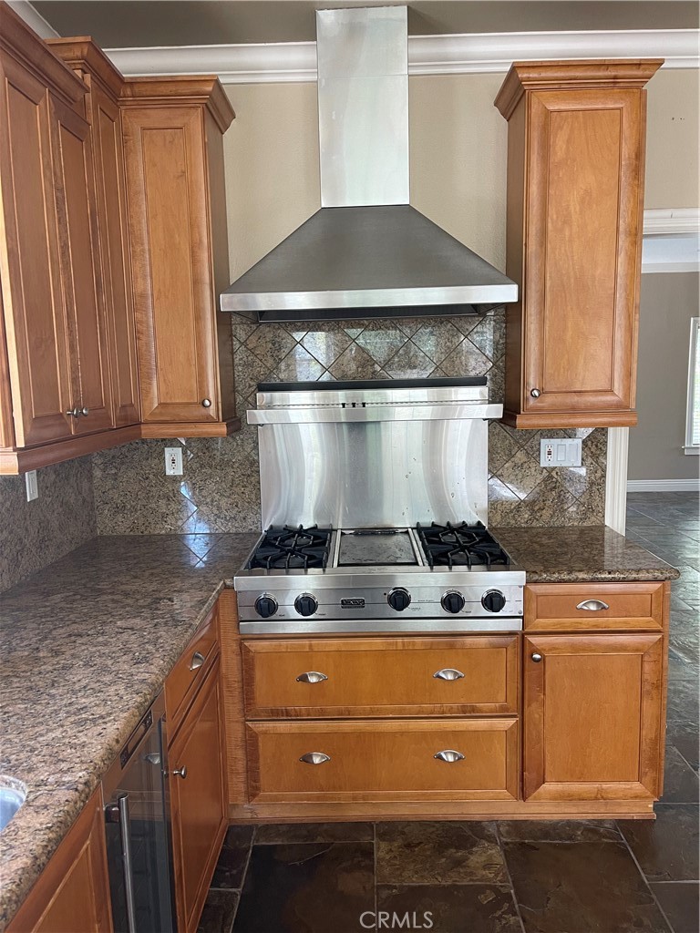 1 Vía Perico Rancho Santa Margarita, CA 92688 - Photo 22 of 22 a kitchen with granite countertop a stove and a cabinets