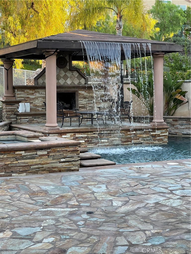 1 Vía Perico Rancho Santa Margarita, CA 92688 - Photo 4 of 22 a view of a porch with a floor to ceiling window next to a yard