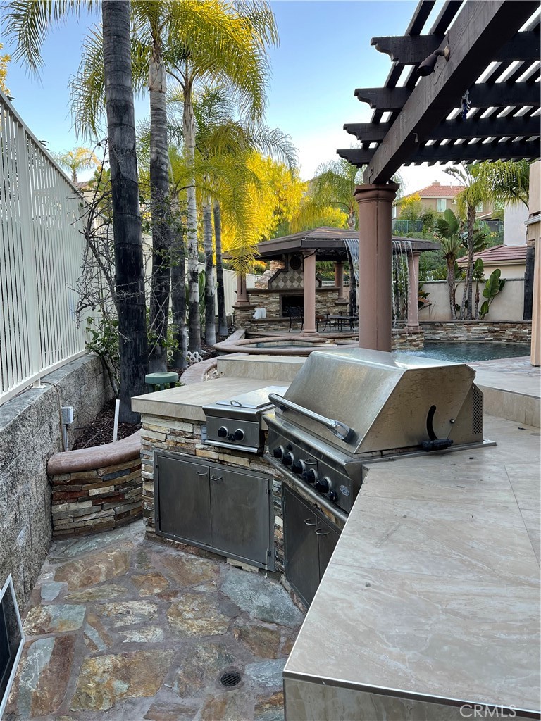 1 Vía Perico Rancho Santa Margarita, CA 92688 - Photo 6 of 22 a view of outdoor kitchen outdoor kitchen view and living room