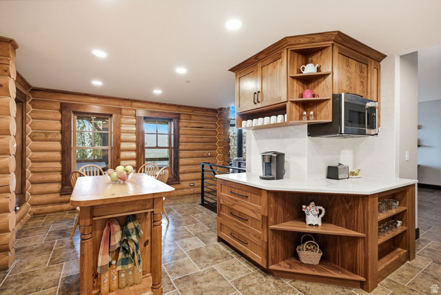 12465 Bone Road Kamas, UT 84036 - Photo 25 of 63 Log-style wall construction, tiled flooring, wood-finish cabinetry, white countertops, and recessed ceiling lighting