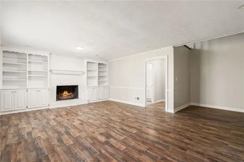 a bedroom with a large bed and ceiling fan