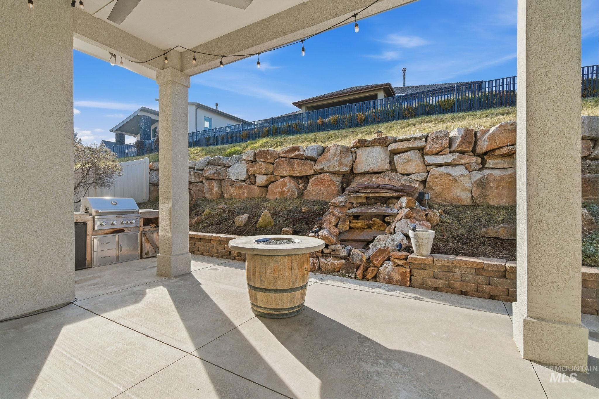 1013 East Radiant Ridge Drive Meridian, ID 83642 - Photo 29 of 36 Fenced backyard with a patio and area for grilling