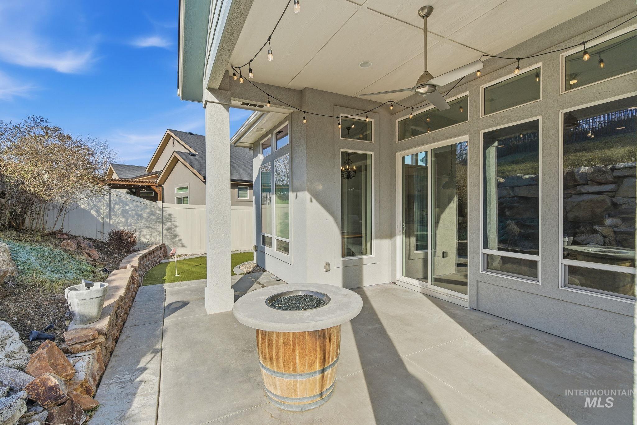 1013 East Radiant Ridge Drive Meridian, ID 83642 - Photo 30 of 36 View of patio / terrace featuring a fire pit and ceiling fan